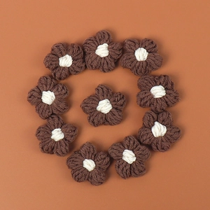 Detail showing 10 handmade crochet brown and white macaron flowers for DIY accessories
