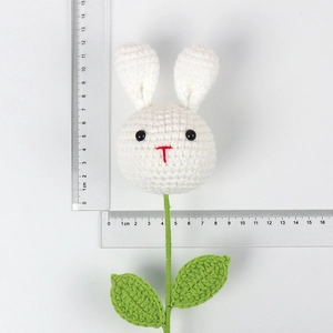 Handmade crochet white rabbit flower with green leaves showing precise size measurements