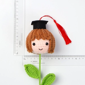 Handmade crochet graduate pig doll showing size measurement of 6cm width and 8cm height