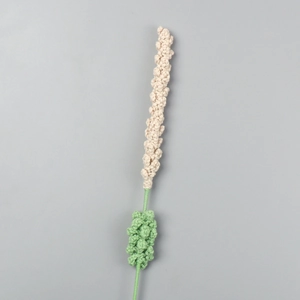 Detailed view of handmade cream crochet lavender flower with soft green knitted stem
