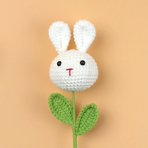 Handmade crochet bunny flower bouquet with white rabbit head and green knitted stem