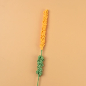 Macro detail of a handmade crochet lavender stem in bright yellow yarn for home decor