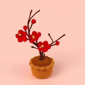 Handmade crochet red winter plum blossom potted plant for festive desktop decoration
