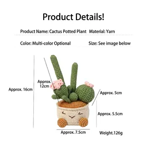Macro shot of handmade crochet cactus with pink flowers and smiling face pot details