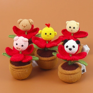 Detail of five handmade crochet animal potted plants with LED battery box switch