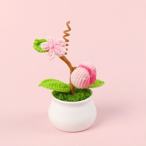 Handmade crochet peach potted plant with pink flower and ceramic vase for home decor