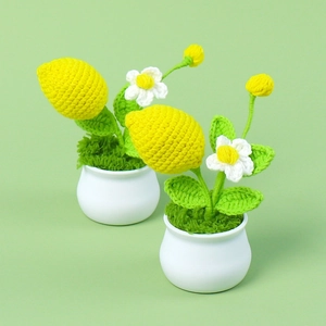 Handmade crochet lemon tree in white pot with green leaves and yellow fruit decor