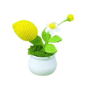Handmade crochet lemon tree potted plant with white daisy in a ceramic pot for desk decor