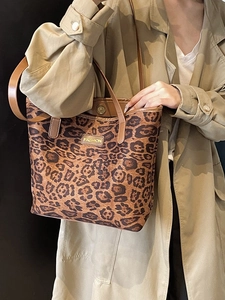 Leopard print tote bag with brown straps and fashion tag, stylish fall handbag for women