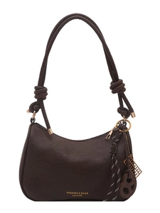Dark brown underarm dumpling bag with knotted shoulder strap and unique metallic charms