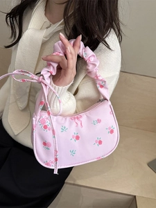 Pink floral printed shoulder bag with ruched handles and sweet bow details
