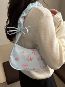 Stylish light blue floral underarm bag with pink rose patterns and ruched strap