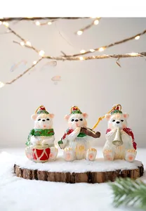 Detailed trio of miniature resin polar bears playing musical instruments on snowy wood base