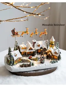Detailed view of illuminated miniature Christmas village with rotating Santa and flying deer