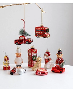 Detailed view of assorted Christmas glass ornaments including London bus and dog soldiers