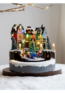 Illuminated Christmas gift shop village scene with colorful LED lights and reindeer sled