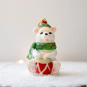 Christmas polar bear resin figurine with green glitter scarf and drum on snow