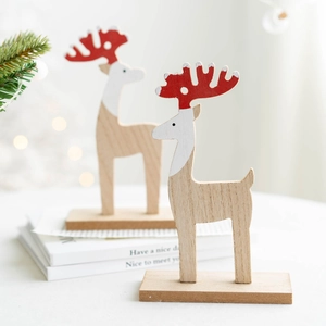 Minimalist wooden reindeer ornaments set with red antlers for Christmas tabletop decor
