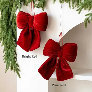 Red velvet Christmas bow hanging ornaments in bright red and burgundy for tree decoration