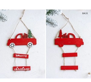Detail view of red wooden Christmas truck ornament with Merry Christmas sign and back view