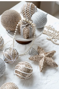 Detail of champagne and silver Christmas ball ornaments with sequins and pearl accents
