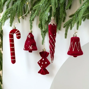 Red flocked Christmas tree hanging ornaments set with golden glitter and star patterns