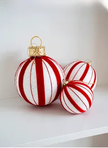 Detail of red and white striped Christmas foam balls with velvet and glitter textures