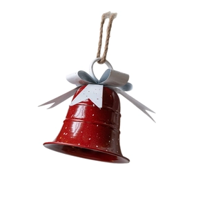 Christmas red metal bell with white snow spots, white bow and rustic jute rope hanging