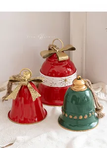 Macro detail of red and green Christmas bells with golden bows and snowflake patterns