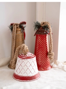 Set of three vintage metal Christmas bells with rustic rope and festive ribbon bows