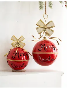 Red Christmas bell ornaments with Merry Christmas hollow design and golden metal bows