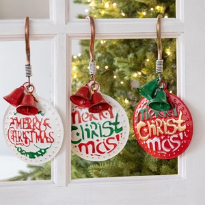 Three vintage iron Christmas door hangers with festive bells and Merry Christmas relief
