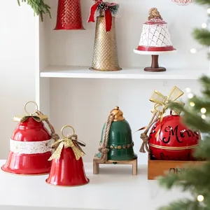Christmas metal bell ornaments in red and gold colors for tree and window decorations