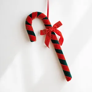 Green and red velvet candy cane ornament with gold glitter and red bow for Christmas tree