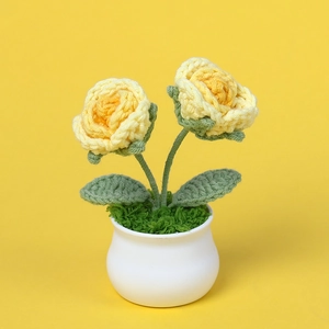 Handmade crochet yellow rose potted plant in white ceramic pot for home decor
