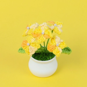 Handmade crochet hydrangea potted plant with yellow flowers and white ceramic pot