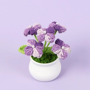 Detailed handmade purple crochet hydrangea flower pot with small white pearls and moss