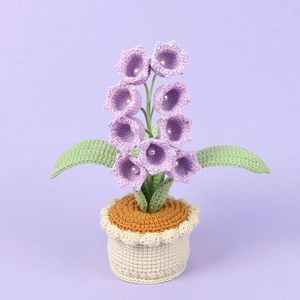Handmade crochet lily of the valley potted plant with purple flowers and knit base
