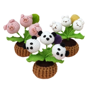 Handmade crochet potted plants with panda, pig, and rabbit animal designs for home decor