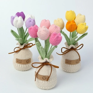 Detailed knit tulip flower pots in purple, pink and yellow with hand made tags