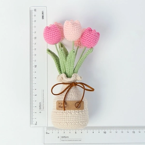 Handmade crochet pink tulip potted plant with dimensions shown by measuring rulers