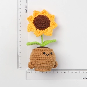 Handmade crochet sunflower potted plant with cute expression, 16cm height measurement