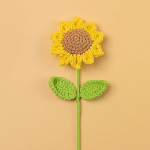 Handmade crochet sunflower bouquet with yellow petals and green leaves for gifts