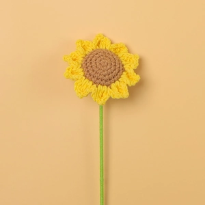 Handmade crochet sunflower with yellow petals and green stem for home floral decoration