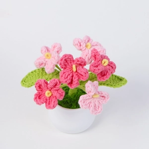 Handmade crochet pink flower potted plant ornament with white ceramic base for home decor