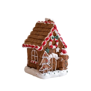 Resin gingerbread house Christmas ornament with candy canes and miniature figurines