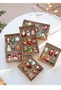 Detailed view of glass Christmas ornaments featuring Santa, snowman, and festive figures