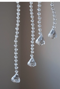 Close-up of clear acrylic beaded garlands with faceted teardrop pendants for Christmas