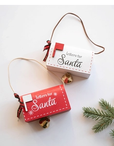 Detail of red and white wooden Santa letter mailboxes with bows and small golden bells