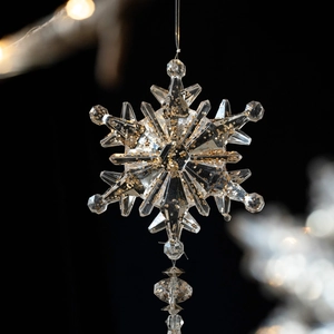 Clear acrylic Christmas snowflake ornament with gold glitter for festive tree decoration